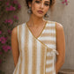 Charming white and mustard sleeveless wrap top featuring a distinctive Block print pattern, elegant mustard piping, and a graceful, contemporary, artisan-inspired tailored silhouette.