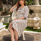 Modern white and grey Ikat shirt dress elevated with an asymmetrical checkered Ikat collar and contrast black accents.