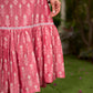 Graceful pink Ikat long dress accented in white, designed with gathered detailing at the fall and a clean sleeveless finish