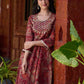 Exquisite deep maroon printed kurta with a graceful bias silhouette, intricate handwork on the yoke, and scalloped sleeve detailing.