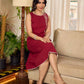 Maroon block printed sleeveless dress with hand block printed floral side panel, off-white accents, and pearl embellishments for a refined, elegant look.