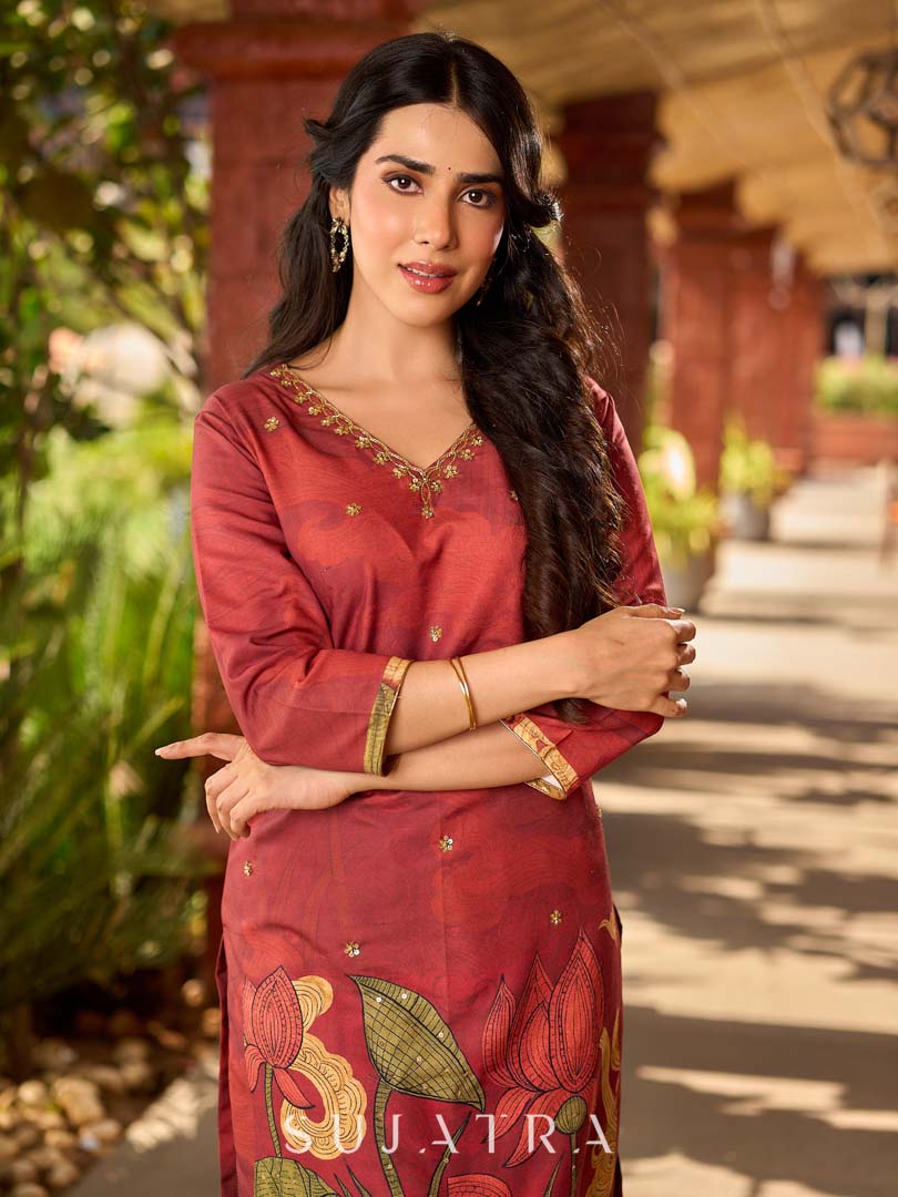 Classic deep rustic maroon kurta with detailed hand embroidery, statement olive and cream Pichwai artwork, and rich gold highlights