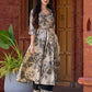 Elegant black–white floral kurta featuring a graceful bias silhouette, intricate mirror embroidery on the neck and sleeves, and a sweetheart neckline.