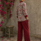 Elegant maroon floral top with intricate maroon pleats, high neckline, covered buttons, and coordinating sleeve cuffs.