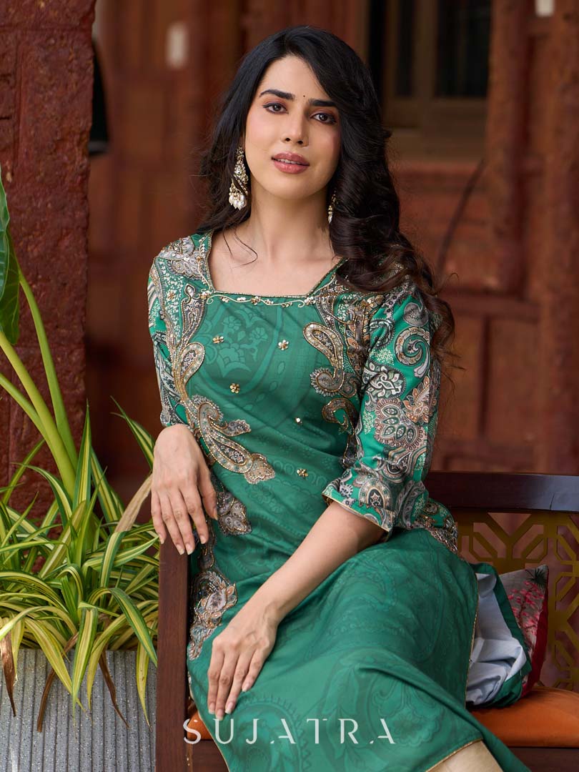 Statement green paisley kurta with detailed hand embroidery beautifully enhancing the print.
