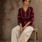 Graceful maroon hand block print top featuring timeless paisley motifs, delicate borders, and an elegant V-neck silhouette, crafted for effortless everyday sophistication.