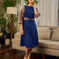 Navy Blue Artisanal Kalamkari prints enhanced with statement sleeves and a waist-defining knotted Kalamkari belt.