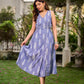 Graceful powder blue Ikat dress showcasing layered overlap details highlighted with white accents.