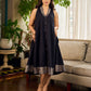 Modern black bias-cut dress showcasing unique artisan-inspired Kalamkari neck trim.