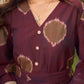 Elegant wine-purple Ikat dress with flowy sleeves, finished with a belt for a softly cinched silhouette.