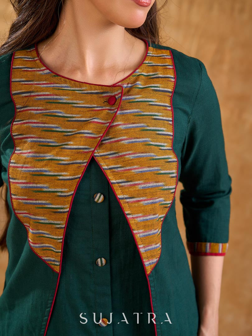 Sophisticated bottle green and mustard Ikat jacket featuring an overlapping neckline closure, front-open design, and rich maroon accents, offering a composed, tailored silhouette for corporate wear.