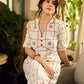 Soft off-white block printed rayon dress with intricate all-over hand block printed checks and florals, a gently gathered yoke, and rich red accents for a refined, elegant everyday look.