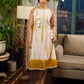 Sunlit ivory tie-dye dress with mustard accents and playful tassel shoulder detailing.