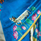 Vibrant Blue Silk Saree with Pichwai Motifs and Floral Border