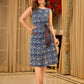 Chic indigo wrap-style dress featuring animal-inspired motifs with a striped belt and refined accents.