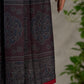 Black Ajrakh printed dress with pleats, maroon accents, and silver embellishments.
