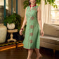 Pista sleeveless block printed dress with red abstract motif panels, a contrasting red collar, and accents for a fresh, artisanal, contemporary look.