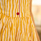 Yellow and white zebra-striped hand block printed sleeveless vintage luxe dress with maroon bird motifs and matching accents for a bold, elegant statement look.