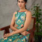 Green peacock motif printed dress with straight neckline and orange accents