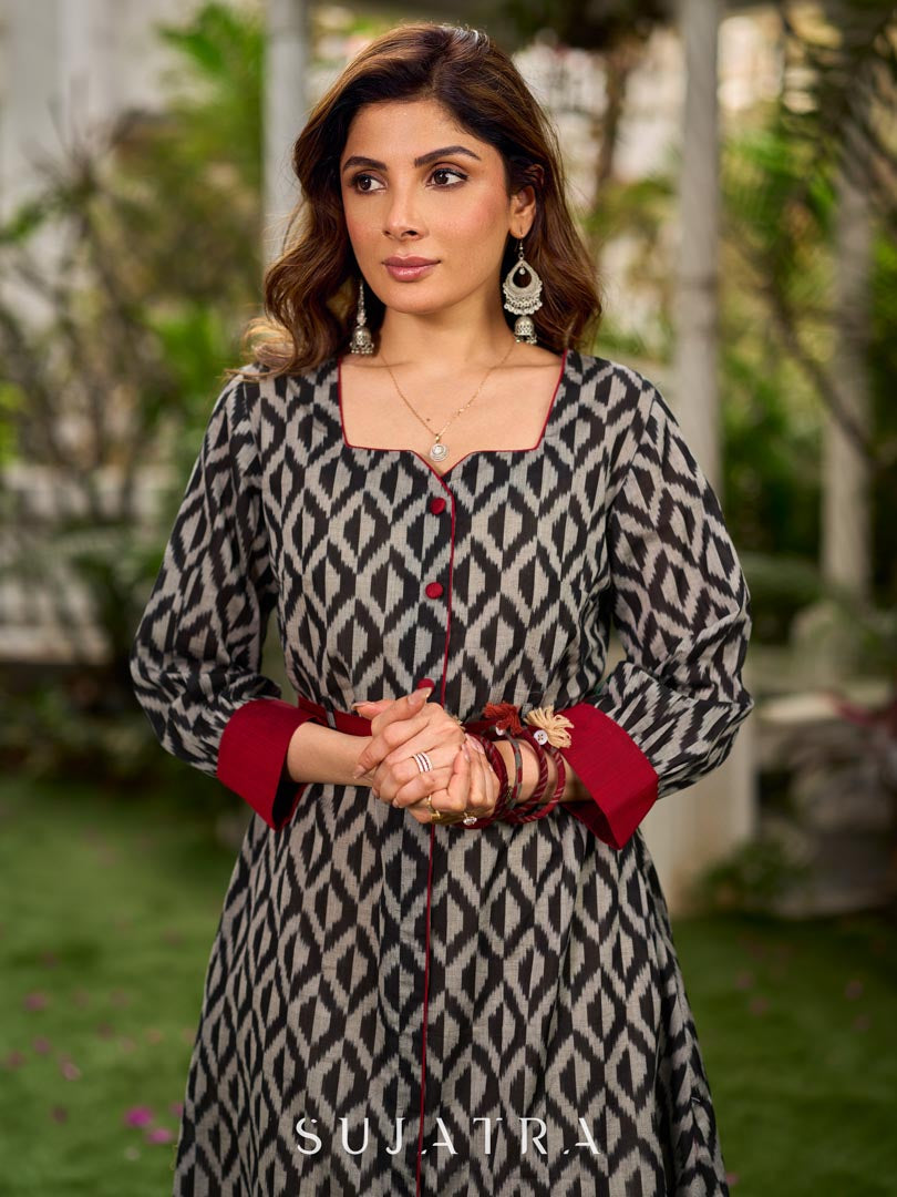 Elegant black grey mercerised Ikat shirt dress featuring a soft square neck, subtle maroon detailing, and a waist belt for a gently flowing silhouette.