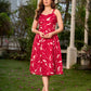 Pretty red dress featuring a sweetheart neckline, pleated waist panel, and soft gathers that create a graceful flow.