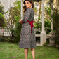 Elegant black grey mercerised Ikat shirt dress featuring a soft square neck, subtle maroon detailing, and a waist belt for a gently flowing silhouette.