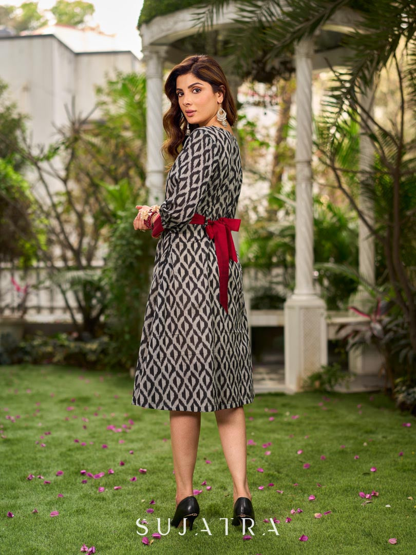 Elegant black grey mercerised Ikat shirt dress featuring a soft square neck, subtle maroon detailing, and a waist belt for a gently flowing silhouette.