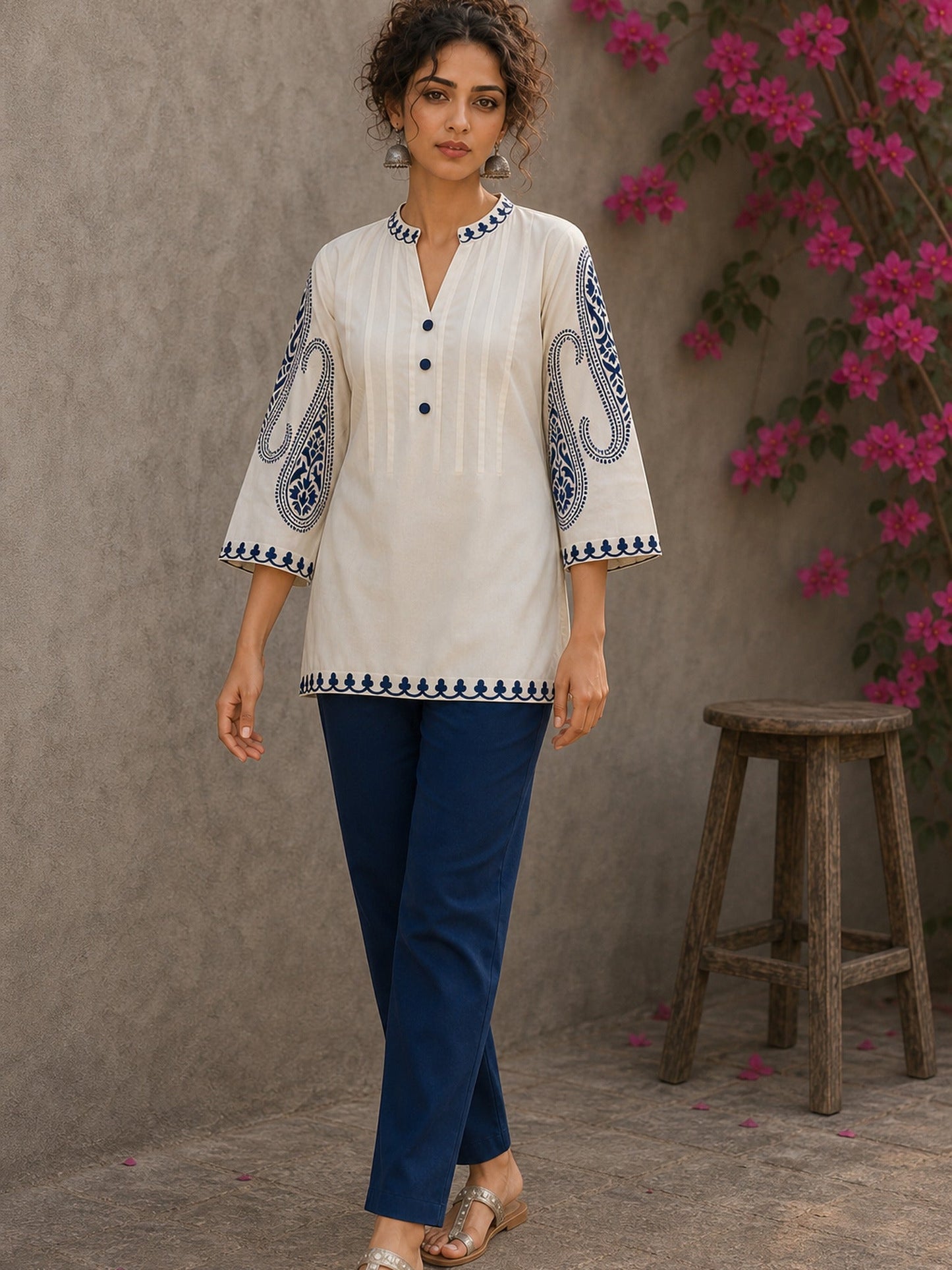 Elegant ivory hand block print top featuring intricate navy blue paisley sleeves, refined contrast detailing, and graceful pintucks, blending artisanal craftsmanship with timeless everyday sophistication.