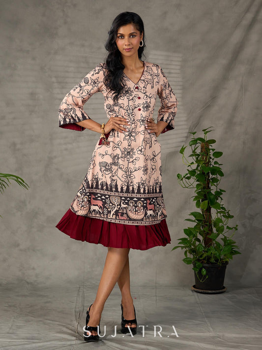 Beige traditional printed dress with rich maroon accents.