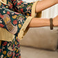 Classic bottle green Kalamkari printed dress with a beige elegant pintuck detailing.