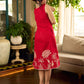 Vibrant red sleeveless dress with a bold off-white floral hand block print at the hem and clean off-white edging for a striking, handcrafted-inspired finish.