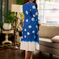 Refreshing cobalt blue shibori tie-dye dress with ivory accents and delicate lace-trimmed neckline.