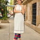 Pristine Off-White Sleeveless Halter Neck Kurta with Vibrant Multicolor Buttons & Hem Trim