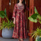 Exquisite deep maroon printed kurta with a graceful bias silhouette, intricate handwork on the yoke, and scalloped sleeve detailing.