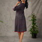 Black Ajrakh printed dress with pleats, maroon accents, and silver embellishments.