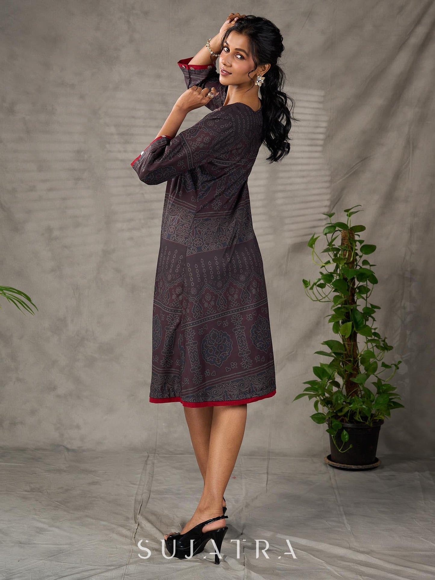 Black Ajrakh printed dress with pleats, maroon accents, and silver embellishments.