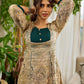 Artisanal beige Madhubani dress featuring intricate motifs, a contrasting green yoke, and refined accents.