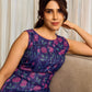 Enchanting purple panel dress featuring vibrant magenta floral prints, a sleeveless silhouette, and a graceful fit-and-flare design for timeless elegance.