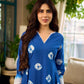 Refreshing cobalt blue shibori tie-dye dress with ivory accents and delicate lace-trimmed neckline.
