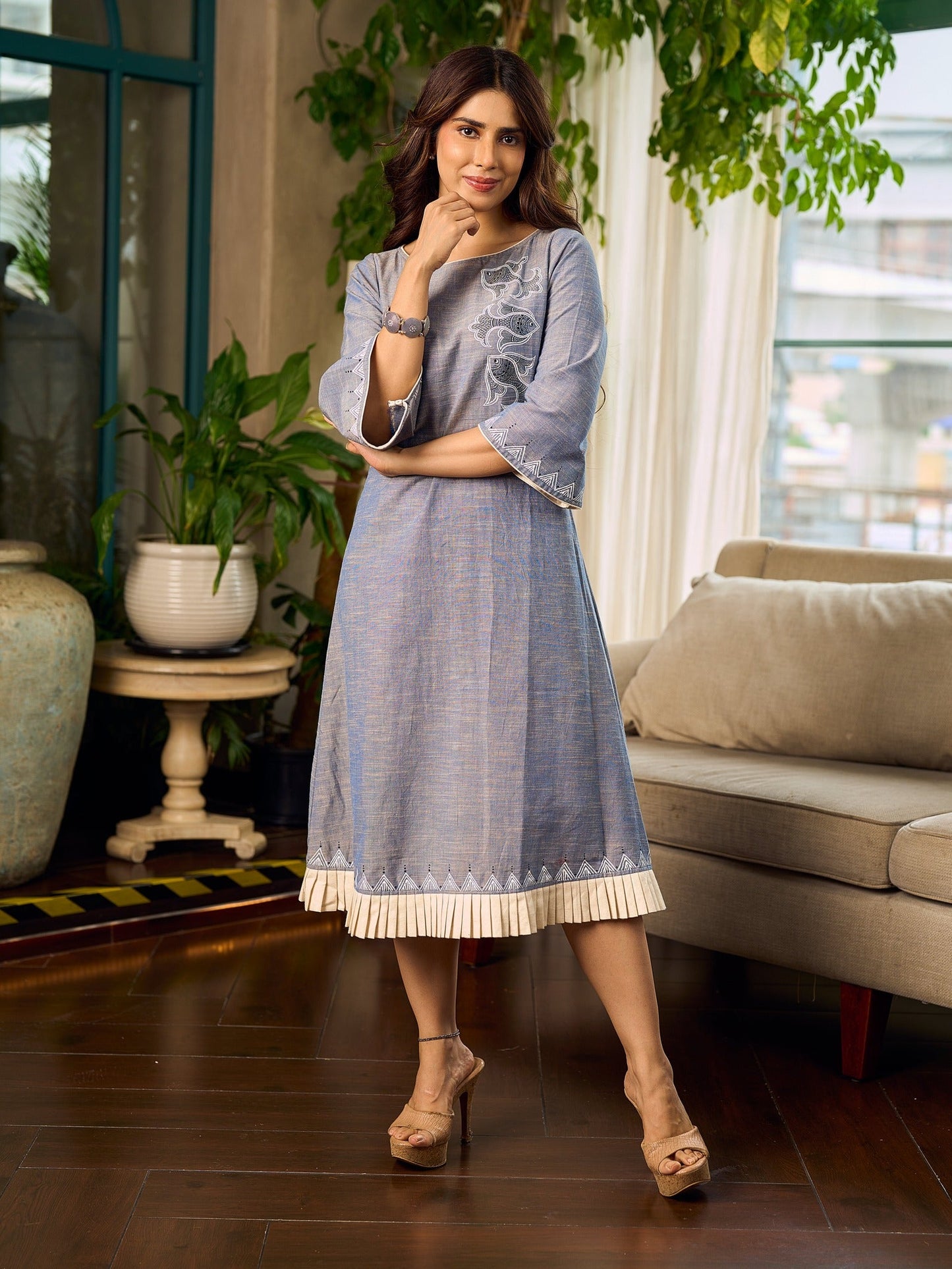Two-tone handloom cotton dress with delicately painted Madhubani fish motifs and pleated hem.