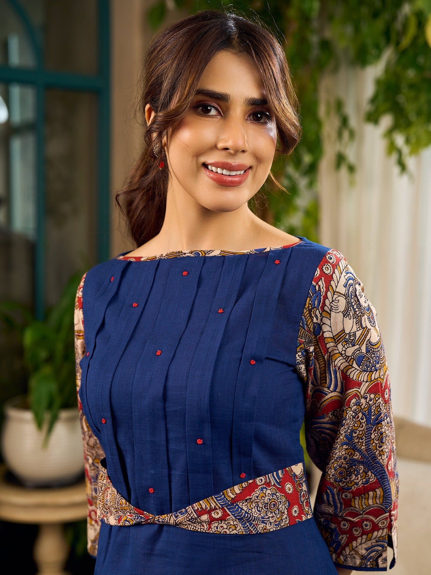Navy Blue Artisanal Kalamkari prints enhanced with statement sleeves and a waist-defining knotted Kalamkari belt.