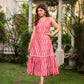 Graceful pink Ikat long dress accented in white, designed with gathered detailing at the fall and a clean sleeveless finish