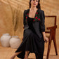 Exquisite black Ikat jacket with offset collar flaps and detailed red floral vine embroidery, delivering a sculpted, high-impact silhouette with refined presence for corporate styling.
