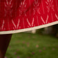 Statement red Ikat halter-neck dress accented in white, designed with a box pleat at the neckline for fluid drape.