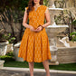 Statement mercerised mustard Ikat dress elevated with drop-shoulder styling, pleated neckline and sleeves detailing featuring soft box pleats for ease and movement