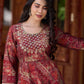 Exquisite deep maroon printed kurta with a graceful bias silhouette, intricate handwork on the yoke, and scalloped sleeve detailing.
