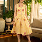 Yellow and white zebra-striped hand block printed sleeveless vintage luxe dress with maroon bird motifs and matching accents for a bold, elegant statement look.