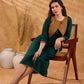Sophisticated bottle green and mustard Ikat jacket featuring an overlapping neckline closure, front-open design, and rich maroon accents, offering a composed, tailored silhouette for corporate wear.