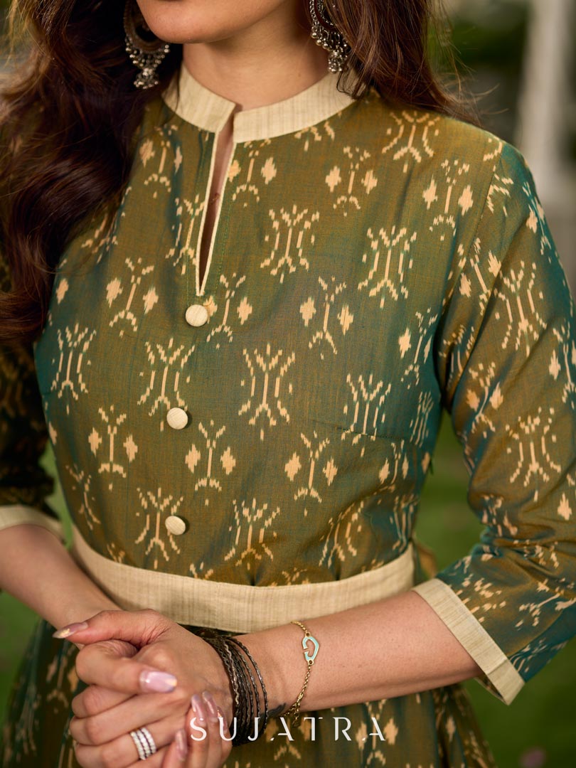 Statement olive green two-tone Ikat dress elevated with cream?gold accents, a structured belt for definition, and a subtle left-front slit.