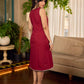 Maroon block printed sleeveless dress with hand block printed floral side panel, off-white accents, and pearl embellishments for a refined, elegant look.